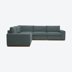 a large sectional couch sitting on top of a white floor