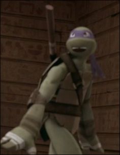 the teenaged turtle is holding a baseball bat