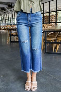 Unleash your inner fashion rebel with the Emmalyn Frayed Ankle Crop Jeans. These dark denim dreamers feature a high rise for a flattering fit, while the wide legs and frayed hem add a touch of edginess. Light distressing adds a nonchalant vibe to complete the look. Who says jeans have to be boring? General Info: 65% Cotton, 32% Polyester, 1.5% Viscose, 1.5% Spandex Machine Wash Cold; Tumble Dry Low Frayed Hem Cropped Wide Legs High Rise Light Distressing Denim Model Info: Height: 5’10” | Bust: 3 Distressing Denim, White Jumpsuit Dress, Plus Size Outerwear, Ankle Boots Flat, Sporty Girls, Crop Jeans, Wide Legs, Jeans Brands, Event Dresses