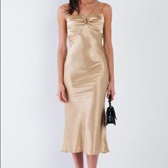 The Andi Gold Dress Is The Perfect Midi Dress That Fits True To Size And Is 100% Polyester. Available In Sizes Small & Medium. Just Select Your Size Below! All Brand New. Comes From Non Smoking Home Super Trendy Style. Chic Gold Silk Midi Dress, Elegant Gold Midi Dress With Spaghetti Straps, Gold Spaghetti Strap Midi Dress, Gold Satin Midi Dress For Date Night, Chic Gold Midi Dress, Gold Midi Length Slip Dress For Evening, Gold Midi Dress For Date Night, Chic Gold Midi Dress For Date Night, Elegant Gold Midi Dress For Brunch