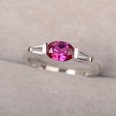 ◆ A delicate triple stone ring displays oval pink ruby, accented with 2 baguette cubic zirconias. It is an unique and beautiful piece that you cannot miss. ◆ Production Description: Main stone Type: Lab Ruby Main Stone Shape: Oval Cut Main Stone Size: 5*7mm Side stone: CZ Metal: 925 Sterling silver - Other options available in the drop down menu ◆ Customization: √Free for Add Engraving √Other Metal Type Available √Other Gemstones & Shapes Available √Personalization Requests Available ◆ Packa Pink Three Stone Ruby Ring, Elegant Pink Ruby Three Stone Ring, Elegant Pink Three-stone Ruby Ring, Pink Oval Three Stone Jewelry, Pink Oval Three-stone Jewelry, Pink Lab-created Ruby Jewelry In Oval Shape, Pink Jewelry With Lab-created Ruby In Oval Shape, Pink Oval Jewelry With Lab-created Ruby, Pink Oval Lab-created Ruby Jewelry