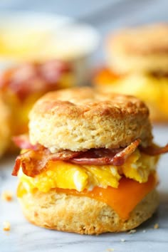 an egg and bacon biscuit sandwich is shown