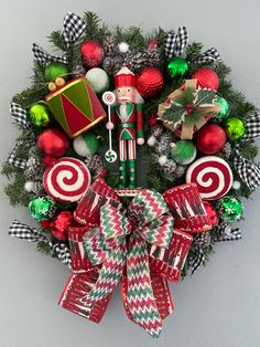 a christmas wreath with candy canes and decorations