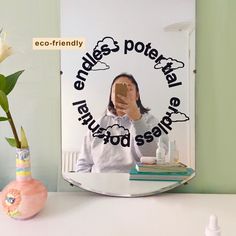 a woman taking a selfie in front of a mirror with the caption endles & poternal natural food service