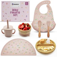 the baby feeding set is pink with rainbows on it