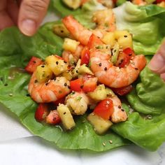 lettuce and shrimp salad with pineapple salsa on the top is ready to be eaten