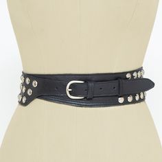 Wide black belt with silver studs for women decorated with about a hundred round studs. Handmade in our atelier. The strap is made with black leather and the buckle and studs are metallic in a silver-tone. This elegant, powerful and feminine belt fits with a lot of different outfits and always enhance your look. Take not that you can wear it with the buckle at the front o at the back. ##MEASURES: Belt Width: 2.7 inches/7 centimeters. Buckle width:1 inche/2,5 centimeters. Strap available for size Adjustable Black Belts With Rivets, Black Leather Belt With Rivets, Black Leather Belts With Rivets, Black Leather Belt With Edgy Style, Adjustable Black Belts With Studs, Adjustable Black Belt With Studs, Black Punk Belt With Rivets, Party Belts With Rivets, Cincher Belt