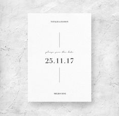 a white wedding card with the words save the date printed on it