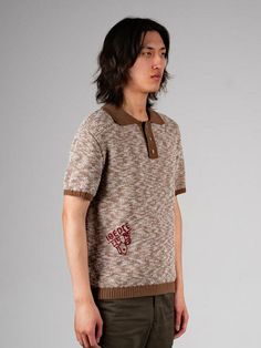 This is a young and casual top by IOEDLE that is made out of high quality and sturdy fabric. With unique design detail and trendy mood, you can style it for your vibrant and casual daily outfit.- Wavey pattern of the knit fabric- Logo embroidery detail- Vintage knit collar- Logo engraved vintage buttons Collared Jacquard Knit Top, Jacquard Knit Collared Top, Textured Knit Polo Collar Top For Fall, Casual Knit Sweater With Polo Collar, Casual Polo Collar Sweater With Relaxed Fit, Casual Sweater With Polo Collar And Relaxed Fit, Brown Collared Knit Tops, Fall Textured Knit Polo Collar Top, Streetwear Knit Tops With Ribbed Collar