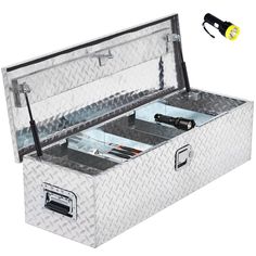 an aluminum tool box with the lid open and tools in it's storage compartment