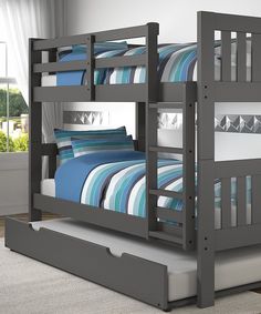 a gray bunk bed with blue and white striped bedspread on the bottom bunk