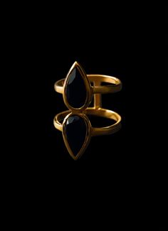 This double pear onyx ring is made with 14kg gold plating that has 3 microns of gold, adding a touch of elegance and class to any outfit. With its unique design and high-quality materials, this ring is the perfect accessory for any occasion. Make a statement with this unique and eye-catching ring, perfect for any occasion. Elevate your style with this must-have accessory. Available in size 5-10. Black Onyx Stone, Onyx Ring, Onyx Stone, Gold Plating, Black Onyx, Onyx, Sterling Silver Rings, Unique Design, Pear