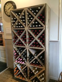 a wine rack with many bottles in it