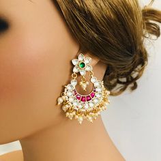 Beautiful and Unique Style Affordable Luxury traditional Bollywood Chandbali earrings with Kundan stones and Colored ruby semi precious Stones. 22k gold plated jewelry Length: 2.25 Inches Click here to see the complete collection of Kundan and Polki Statement Earrings at AryaFashions: https://www.etsy.com/shop/AryaFashions?section_id=25872820 Follow us on social media for new and latest designs: Facebook: www.facebook.com/shoparyafashions Pinterest: www.pinterest.com/aryafashions Instagram: www. White Chandbalis With Tilla For Reception, Heavy White Chandbalis For Reception, White Bollywood Earrings For Reception, White Temple Jewelry Chandelier Earrings For Celebration, Bollywood White Earrings For Reception, White Temple Jewelry Chandelier Earrings For Festivals, Bollywood Style White Earrings For Reception, White Meenakari Chandbalis For Celebration, White Latkan Bridal Earrings For Reception