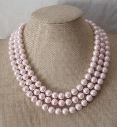 PREFERENTIAL POLICIES : The order is $50 or more.There will be a 10% discount.long-term effective. Please use the coupon code: CZH10 Welcome back to my shop: https://www.etsy.com/shop/pearlandjewelry Description of the product in the picture: The necklace is 60 inches long ,and I make them with 10mm light pink glass pearls, The pearls are individually hand knotted . It is very stylish ,It is nice for your wedding. The picture color is light pink . Can choose other colors are:ivory,white,light pi Pink Pearl Chain Jewelry For Wedding, Pink Round Beads Jewelry For Bridesmaid Gift, Elegant Pink Pearl Necklace For Party, Pink Pearl Necklace With Round Beads For Party, Pink Pearl Chain Necklace For Wedding, Elegant Pink Pearl Beaded Necklace, Elegant Pink Beaded Bridal Necklace, Pink Pearl Chain Beaded Necklaces For Wedding, Pink Pearl Chain Beaded Necklace For Wedding