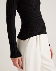 Line up the denim and skirts, because this soft wide rib knit with a slightly cropped, hip length will bring a dose of comfy-luxe to it all. Our cotton cashmere is elevated, lightweight, and breathable, making it the perfect pick for outfits year-round.  | Quince | Women's Cotton Cashmere Ribbed Long Sleeve Sweater in Black, Size XL Elegant Ribbed Stretch Sweater, Chic Ribbed Turtleneck Knit Top, Versatile Ribbed Sweater For Work, Versatile Ribbed Workwear Sweater, Modern Ribbed Sweater For Fall, Chic Sweater With Ribbed Collar For Spring, Chic Stretch Knit Top With Ribbed Collar, Chic Cropped Ribbed Bottoms, Chic Stretch Knit Top With Ribbing