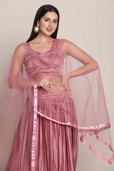 color-pink, fabric-silk, work-self design, brand-name-krupali-savani,occasion-festivewear, occasion-wedding-guest, womenswear,ideal-for-women, lehengas, Product Features: Color: Pink Lehenga Fabric: Satin Silk Choli Fabric: Satin Silk Work: Self Design Sleeves: Sleeveless Neck Type: V Neck Wash Care: Dry Clean Occasion: Festivewear, Wedding Guest Product Type: Lehenga Choli with Dupatta Disclaimer: There will be slight difference in digital to actual image