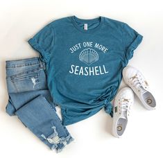 Just One More Seashell TShirt makes a fun tropical beach vacation tee for girls trips to the ocean, tropical island vacay or relaxing days at the beach. Whether you enjoy sunning, shelling, surfing or relaxing on the sand, wear this trendy cute beach tee. T-SHIRT MATERIAL & FEATURES: * 100% Ring-Spun Cotton * Lightweight unisex design * Tear Away Label * Shoulder Taping * Printed in the USA * DTG Printing for high quality imprint (Direct to Garment) - Not iron on, vinyl or screen printed SIZ Casual Ocean Color Tops For Beach, Casual Ocean Color Beach Tops, Cotton Tropical Tops For Beach Season, Blue Cotton T-shirt For Family Vacation, Blue T-shirt For Family Vacation In Summer, Blue T-shirt For Family Vacation Summer, Summer Crew Neck Tops For Family Vacation, Blue Casual T-shirt For Family Vacation, Summer Cotton Top For Family Vacation