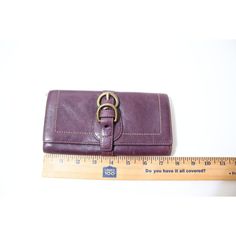 This Coach wallet is a must-have for any fashion-forward woman. The wallet features a beautiful purple color with legacy stripes that add a touch of classic style. It is a trifold full size wallet, perfect for carrying all your essentials. The wallet is made of high-quality leather and has a stripe interior that adds a pop of color to your everyday look. The wallet includes several features like credit card and folding compartments, making it practical for everyday use. It is a designer piece, perfect for any occasion. The wallet is 7.5 inches long and 4 inches wide, making it the perfect size for your purse. This wallet is a great addition to any collection and is sure to impress.Flaws. See pictures. Zoom In.Gold hardware has scratchesLeather has scuffs.Pen Mark.Trifold. Purple Wallets With Interior Card Slots Gift, Elegant Purple Wallets For Travel, Purple Wallet With Card Slots For Everyday Use, Purple Wallets With Card Slots For Everyday Use, Athletic Wear Fashion, Winter Handbags, Elegant Purple Leather Wallets, Lavender Sugar Scrub, Corporate Women