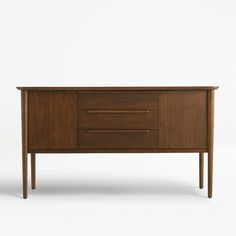 the sideboard is made from wood and has two drawers on one end, and an open drawer on the other