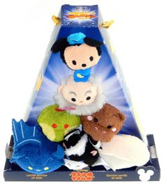 several stuffed animals are placed on top of each other in a toy display case,