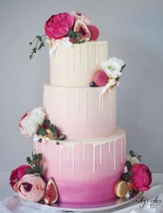 a three tiered cake with flowers and icing on the top is displayed for instagram