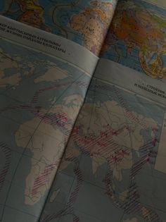 an open book with maps on it