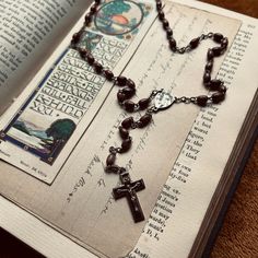 Old vintage Catholic Rosary beads, handmade, sourced from Vienna.  📿Oval wood beads, 2 are missing (shown in photo 3). 📿Silver coloured metal ornate crucifix with black inlay. 📿Miraculous centre medal. As this rosary is antique/vintage, the beads and metal will show signs of age, such as rust and discolouration. I have chosen not to clean or polish the rosaries, as I feel the aging adds to the aesthetic. Free UK postage for orders over £20. Any questions, drop me a message ❤️🔥 Vintage Silver Handmade Rosary, Handmade Vintage Silver Rosary, Handmade Silver Vintage Rosary, Handmade Brown Crucifix Rosary, Rosary Beads Catholic, Cholo Art, Glad Tidings, Catholic Rosary, Rosary Catholic