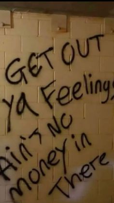 graffiti written on the side of a white brick wall with words that read, get out you feelings try in someone else