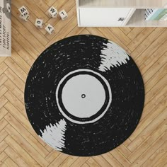 a black and white rug with a record on it