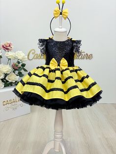 Bee Dress. Baby girl dress for bee birthday. Bee costume.Introducing our stunning yellow and black bee-inspired baby dress, perfect for birthdays and special occasions! This eye-catching dress features a bright and vibrant color palette, with a sparkling sequin fabric adorned with lace detailing on the shoulders and a charming bow on the waist. The combination of yellow and black creates a striking contrast that is sure to make your little one stand out in any crowd. The shiny sequin fabric adds a touch of glamour and makes the dress truly unique. The intricate lace detailing on the shoulders adds a delicate and feminine touch, while the bow on the waist adds a playful and whimsical element. The knee-length silhouette of this dress adds a youthful and energetic vibe, perfect for active lit Fabric Bee, Bee Costume, Black Bee, Bee Dress, Dress Baby Girl, Bee Birthday, Bee Inspired, Dress Costume, Bee Theme