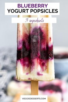 blueberry yogurt popsicles on a wooden stick