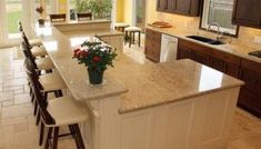 a large kitchen with an island counter top