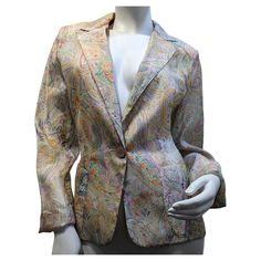 ETRO silk jacket made in Milano Italy Etro Blazer multi-color, floral print, notch lapel, front button closure, long sleeves and front pockets. Size 46 Length from shoulder 65cm / 25,60 inches Length from sleeve 65cm / 25,60 inches Composisoon 100% silk Since its creation in 1968, Etro has managed to keep the fashion world on edge with its now inseparable paisley prints. The designer Veronica Etro, guards the legacy of the Etro family, making references in her collections to her endless archives Silk Blazer With Notch Lapel And Pockets, Elegant Floral Print Office Outerwear, Elegant Tailored Floral Print Outerwear, Floral Print Fall Office Blazer, Silk Outerwear With Pockets And Lapel Collar, Silk Outerwear With Lapel Collar And Pockets, Spring Silk Outerwear With Pockets, Formal Fall Floral Print Blazer, Silk Single-breasted Outerwear For Office