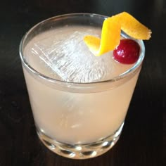 a drink with fruit garnish on the rim