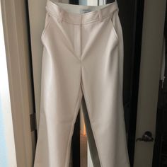 Never Worn Aritzia Pants In A Creamy White Color. White Bottoms With Belt Loops For Work, White Bottoms With Belt Loops For Business Casual, White Business Casual Bottoms With Belt Loops, White Wide Leg Full Length Pants For Office, White Full Length Wide Leg Pants For Office, White Workwear Bottoms With Belt Loops, White Tapered Leg Work Pants, White Straight Workwear Pants, White Tapered Leg Pants For Business Casual