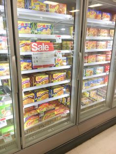 a display case in a grocery store filled with lots of food and snacks for sale