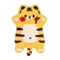 a yellow tiger rug with paws on it's chest and eyes closed, sitting in front of a white background