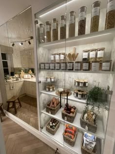 a glass display case filled with lots of food