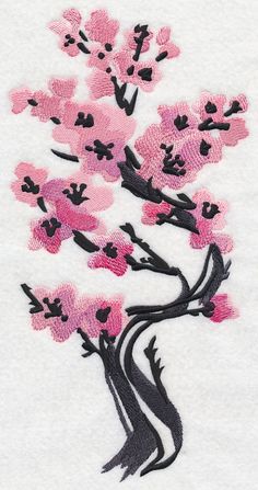 a white towel with pink flowers and black leaves on it's side, in the shape of a tree