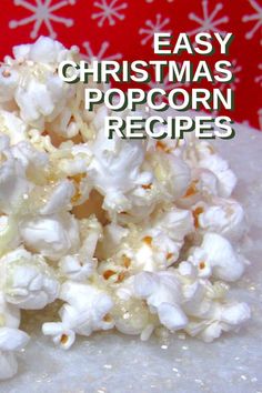 a pile of popcorn with the words easy christmas popcorn recipes on it and snowflakes in the background