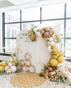 a table topped with balloons and flowers next to a sign that says sweet as pies