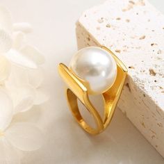 ✦ Embrace elegance with our Y-shaped ring featuring a lustrous pearl, available in luxurious gold or sleek silver. Crafted with sophistication and plated in radiant 18K gold, this ring exudes timeless charm and refined style. Elevate your ensemble with the delicate beauty of pearls, perfect for adding a touch of sophistication to any look.----------- DETAILS ------------ Color: Gold/ Silver- Ring Size: US 6, US 7, US 8- Width: 1.8cm- Materials: 18K Gold Plated, Titanium Steel, Pearl- SKU: A166 Wedding Ring Elegant, Gothic Minimalist, Pearl Cocktail Ring, Pearl Rings, Woman Jewelry, Crystal Hoop Earrings, Gold Collar, Fashion Jewelry Earrings, Split Ring