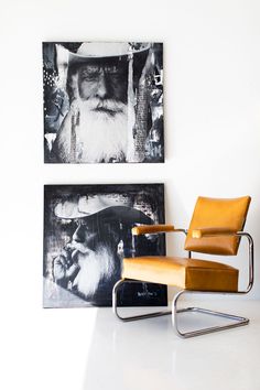 a chair sitting in front of two pictures on the wall