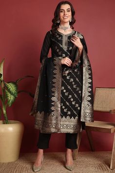 Grab this beautiful 3-piece set. The set comes with ethnic motif printed straight shape kurta has v neck, 3/4th sleeves & calf length teamed with solid trouser pant with side pocket and a dupatta. Color - Black Kurta Fabric-Silk Blend Pant Fabric-Silk Blend Dupatta Fabric - Silk Blend Neck-V Neck Sleeves-3/4th Sleeves Work -Ethnic Motif Print Detailing Washing Instructions-Dry Clean DISCLAIMER - The color of the product may be differ due to screen settings of device. A misprint here and a color Elegant Chanderi Kurta With Traditional Patterns, Elegant Sets With Traditional Patterns For Festivals, Elegant Kurta With Traditional Patterns For Festive Occasions, Elegant Kurta With Traditional Patterns For Diwali, Elegant Festive Kurta With Traditional Patterns, Elegant Salwar Kameez With Traditional Patterns For Festive Season, Elegant Salwar Kameez With Traditional Patterns For Festive Occasions, Elegant Festive Salwar Kameez With Traditional Patterns, Elegant Kurta With Traditional Patterns For Eid