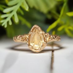 Show your love with this stunning Citrine ring - handcrafted in wax and cast in Solid 14k Gold, its organic molten band exudes natural charm. This one-of-a-kind engagement ring features a stunning pear shape yellow crystal as the November birthstone - in celebration of love's eternal bond.T H E ∙ S M A L L ∙ D E T A I L S• Pear shape faceted Citrine (8-10mm)• Solid 14k Gold textured bandM A T E R I A L ∙ O P T I O N S• Sterling Silver• Solid 14k GoldYou will receive a ring very similar to the on Citrine Engagement Ring, Ametrine Ring, Citrine Ring Engagement, Yellow Diamond Engagement Ring, Nature Inspired Rings, Yellow Diamond Rings, Yellow Engagement Rings, Topaz Engagement Ring, Citrine Ring