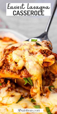 the lasagna casserole is being lifted with a fork