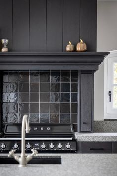 a stove top oven sitting inside of a kitchen