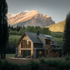 a house in the middle of a forest with mountains in the backgrouds