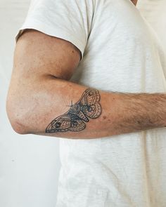 a man with a tattoo on his arm